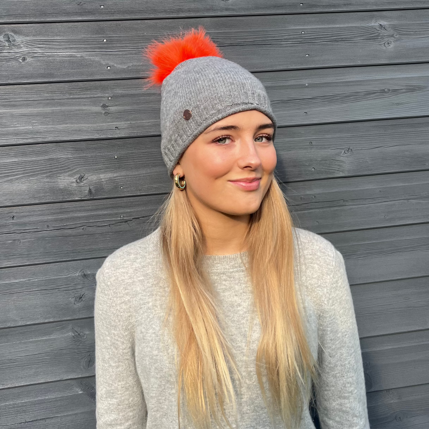 Grey cashmere plain knit beanie with faux fur pom