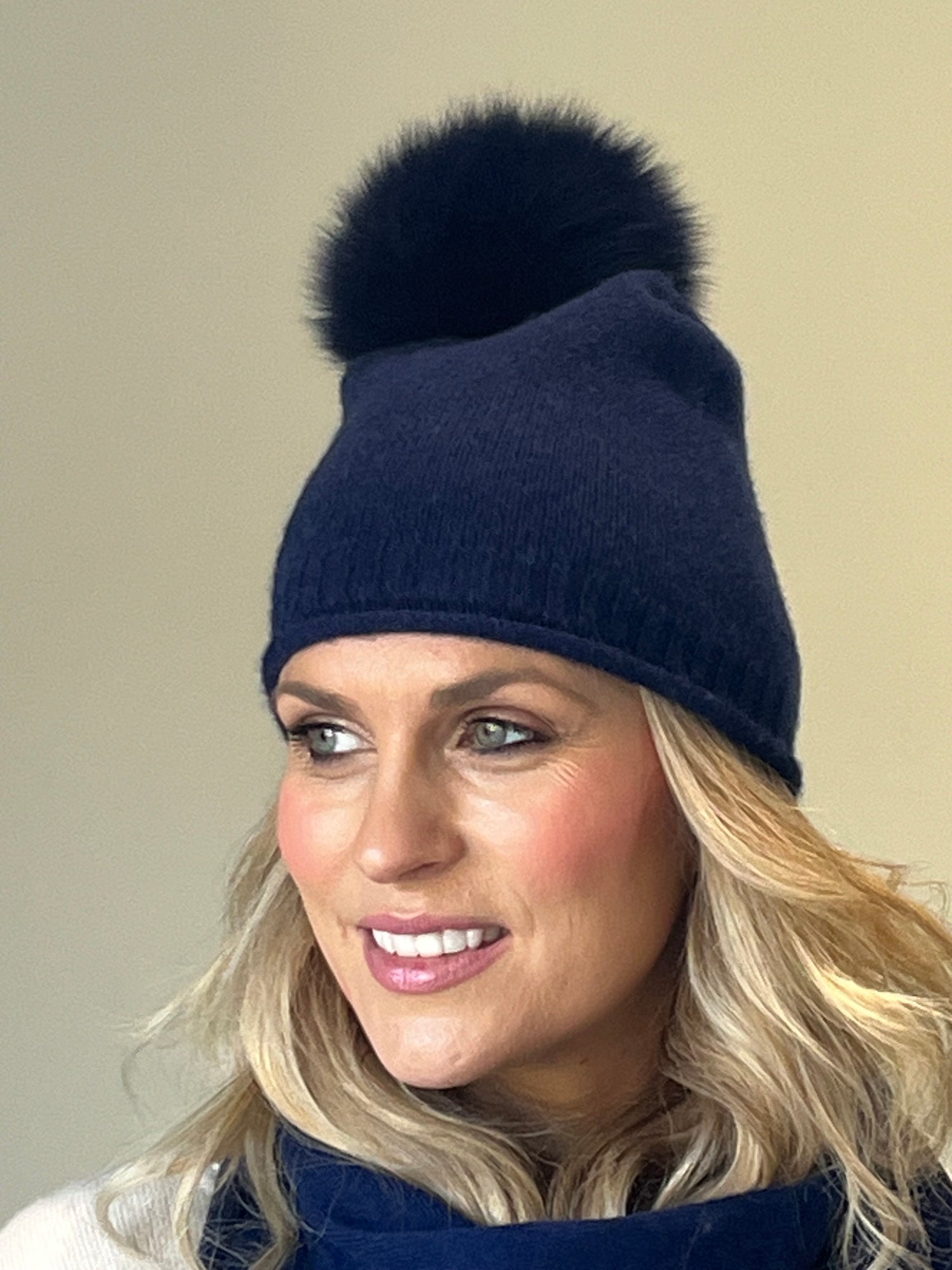 Navy cashmere beanie with detachable faux fur pom pom