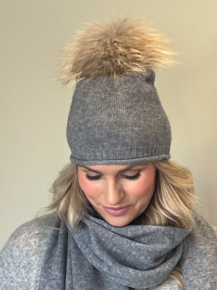 Grey cashmere beanie with a natural fur pom pom