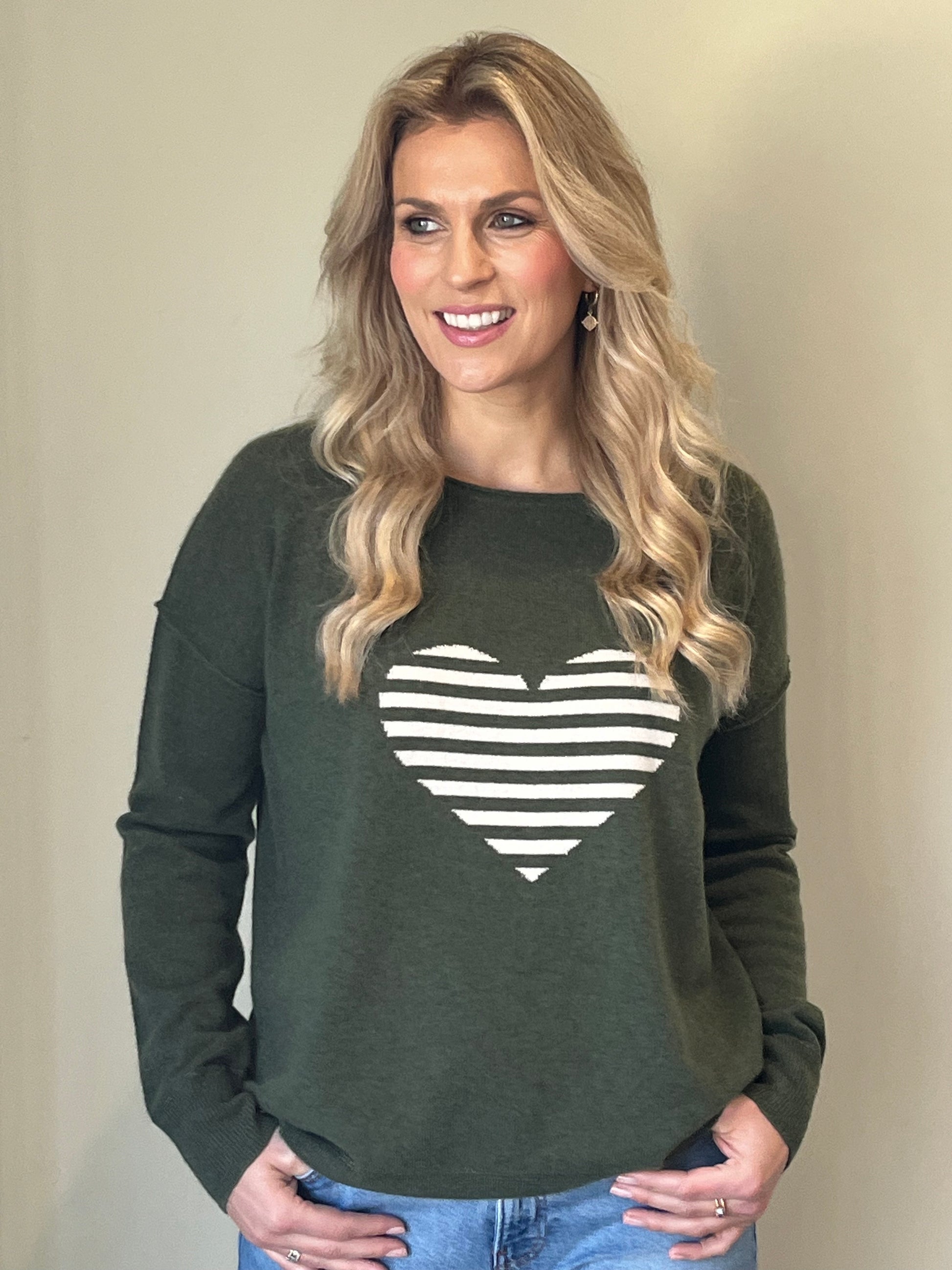 Relaxed olive crew neck sweater with winter white striped intarsia heart