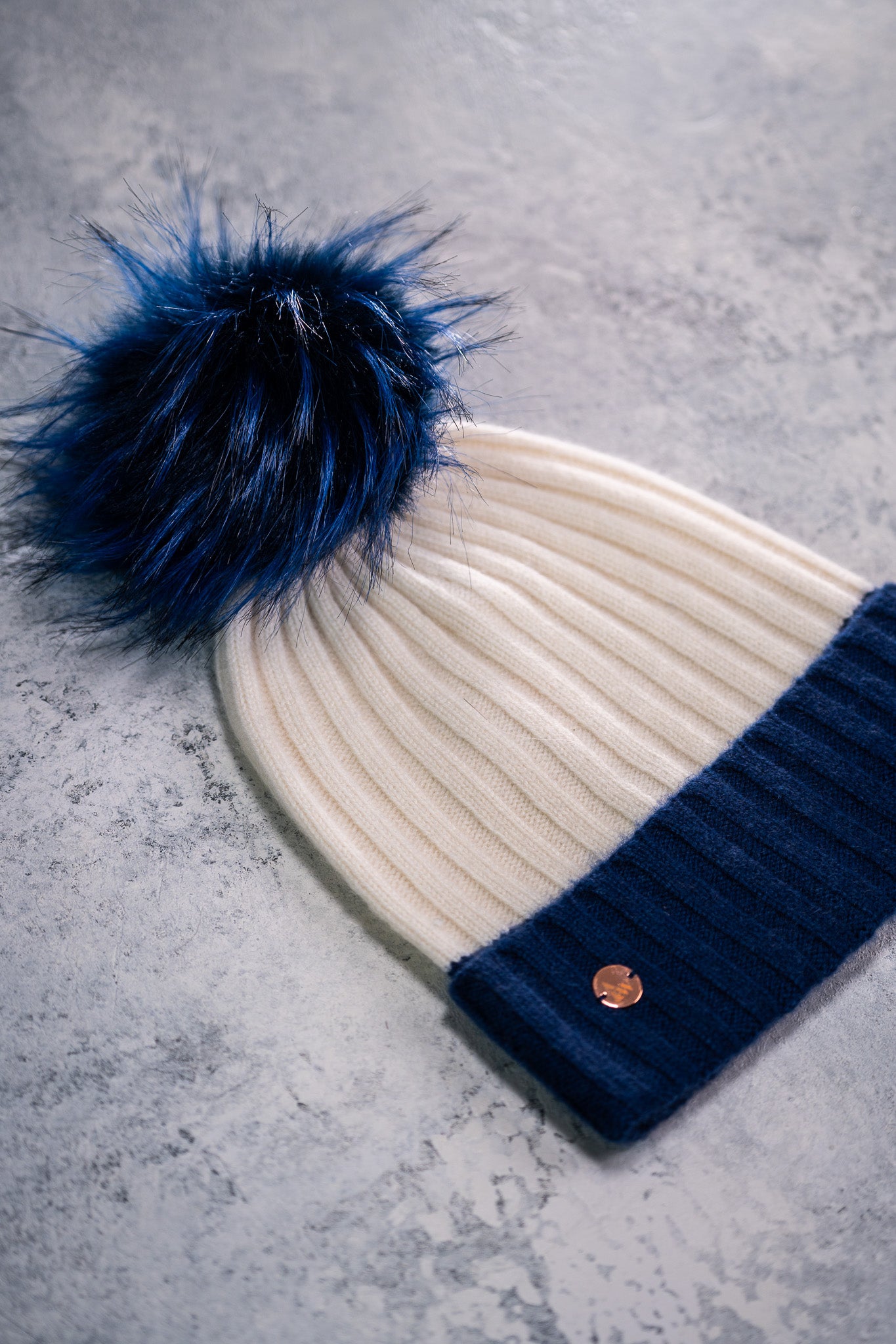 100% Cashmere rib colour block beanie with faux fur pom