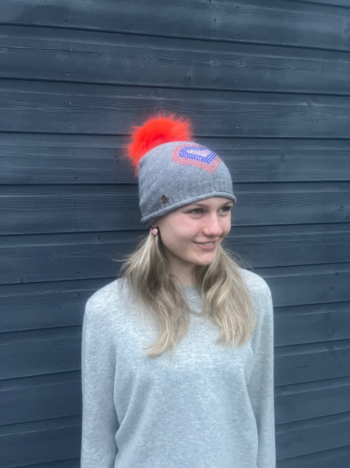 Grey cashmere plain knit beanie with heart embellishment & faux fur pom