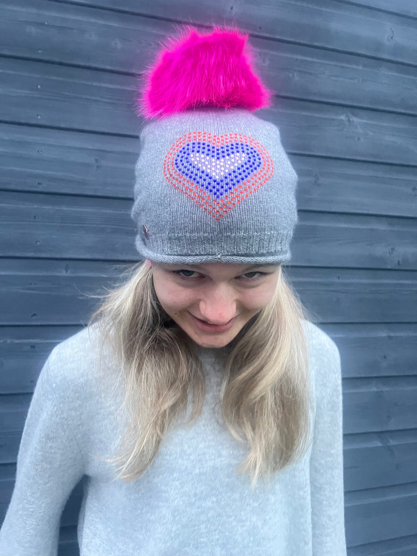 Grey cashmere plain knit beanie with heart embellishment & faux fur pom