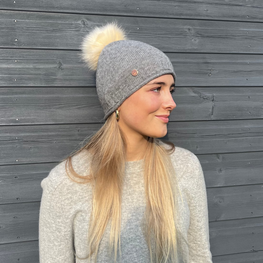 Grey cashmere plain knit beanie with faux fur pom